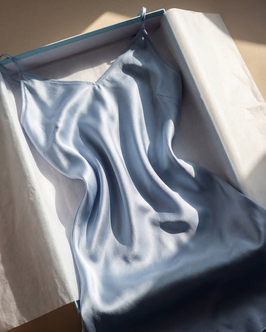 Light Blue EcoSilk Sleep Chemise draped elegantly over luxury gift box