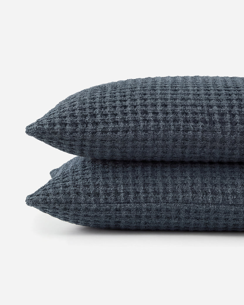 Two Snug Waffle Shams in Midnight stacked on white background showing waffle texture and plush edge detailne. 🌿