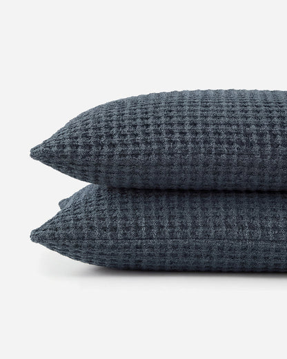 Two Snug Waffle Shams in Midnight stacked on white background showing waffle texture and plush edge detailne. 🌿