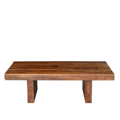Solid seesham wood coffee table with thick flat top and chunky block legs shown against white background, natural grain variation visible across the surface
