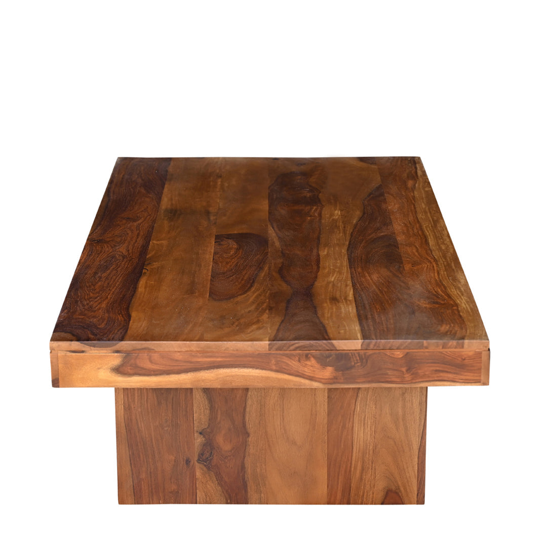 Overhead view of solid seesham wood coffee table showing natural grain variation across the wide plank surface with rich dark and warm brown tones throughout
