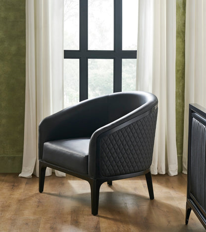 Top-Grain Leather Lounge Chair black curved form diamond quilting window natural light styled
