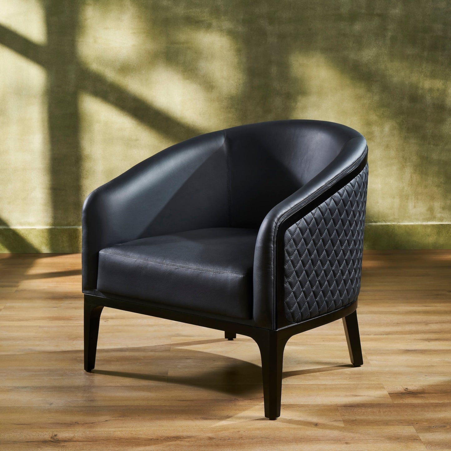 Top-Grain Leather Lounge Chair black three quarter view diamond quilting hardwood legs natural light