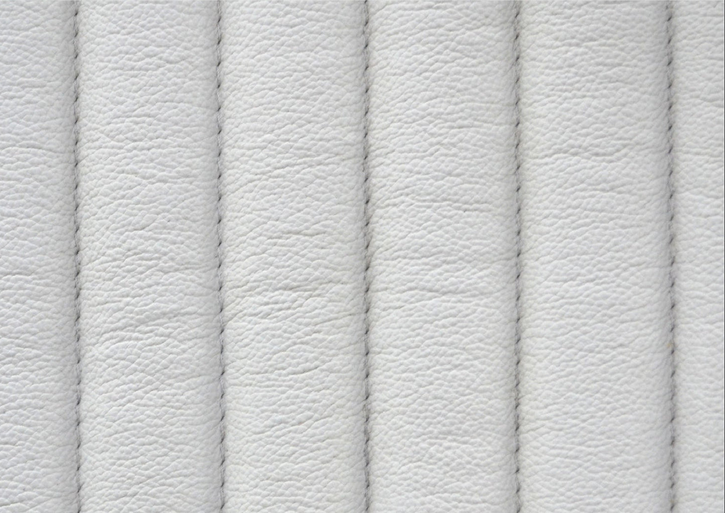 Top-Grain Leather Lounge Chair white genuine leather close texture natural grain detail 