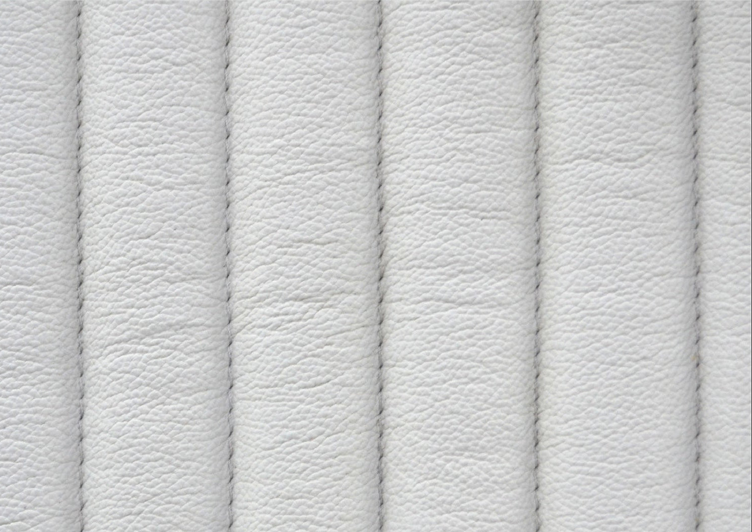 Top-Grain Leather Lounge Chair white genuine leather close texture natural grain detail 