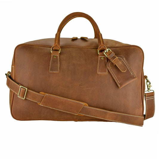 WANDERLUST Roadster leather travel bag in British Tan genuine cowhide with gold hardware and removable shoulder strap against white background


