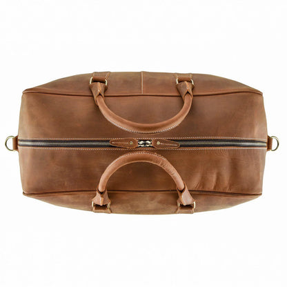 WANDERLUST Roadster leather travel bag top-down view showing dual cowhide handles gold hardware and structured British Tan body opening

