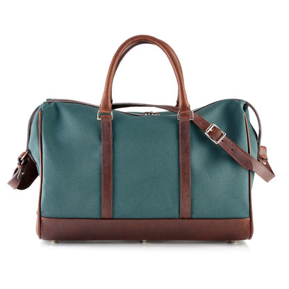 Wanderlust Weekender canvas duffel in Classic Green with dark brown English milled leather trim rolled handles and adjustable shoulder strap

