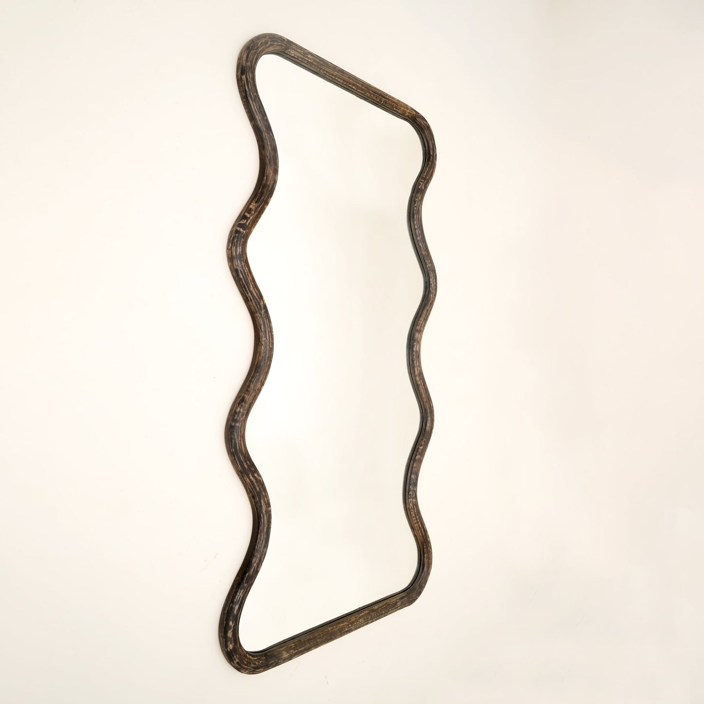 Close-up of wavy mango wood wall mirror frame showing brown antique finish texture and handcrafted wood grain detail against neutral background

wavy-mango-wood-wall-mirror-frame-close-up-brown-antique-finish-texture-handcrafted-wood-grain-detail