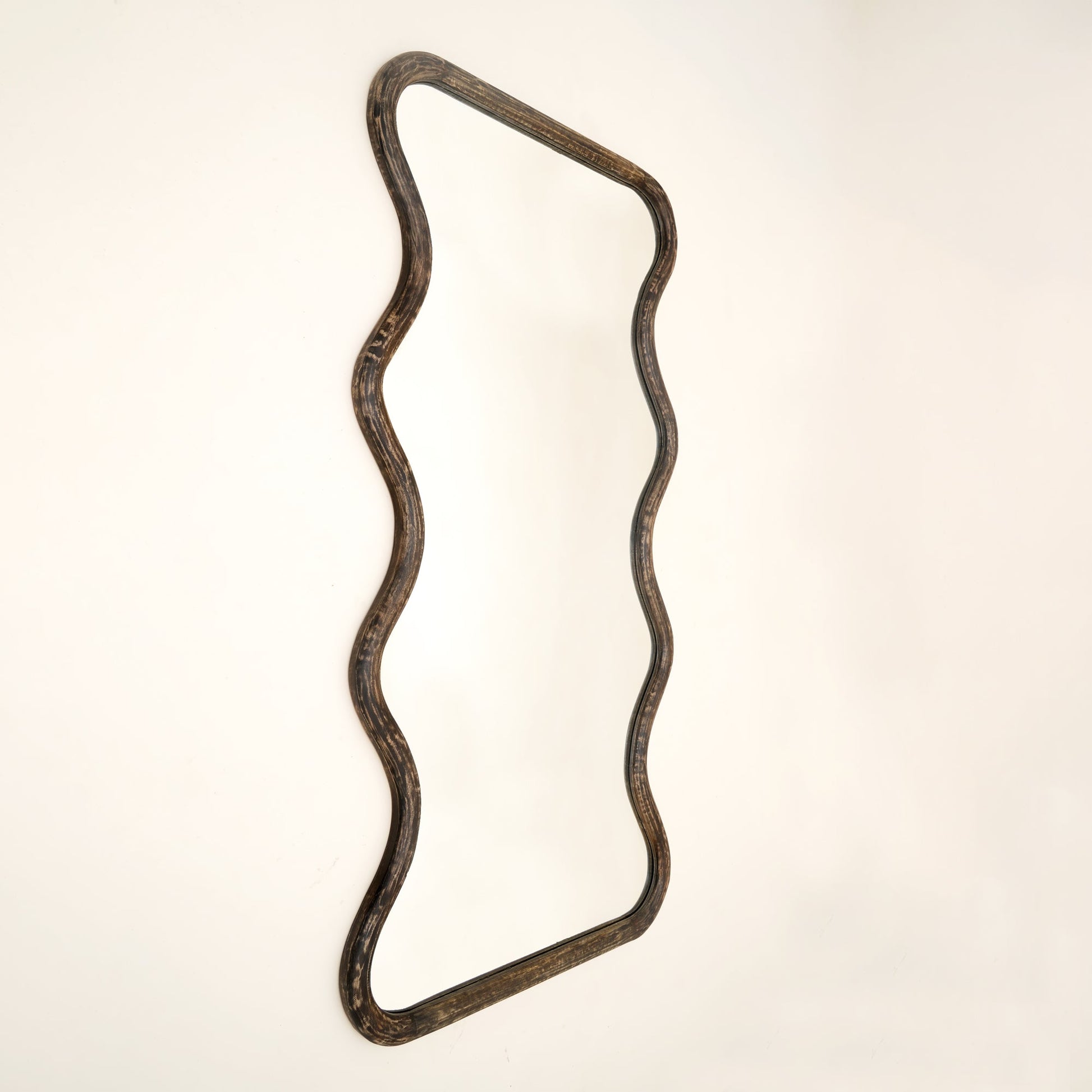 Close-up of wavy mango wood wall mirror frame showing brown antique finish texture and handcrafted wood grain detail against neutral background

wavy-mango-wood-wall-mirror-frame-close-up-brown-antique-finish-texture-handcrafted-wood-grain-detail
