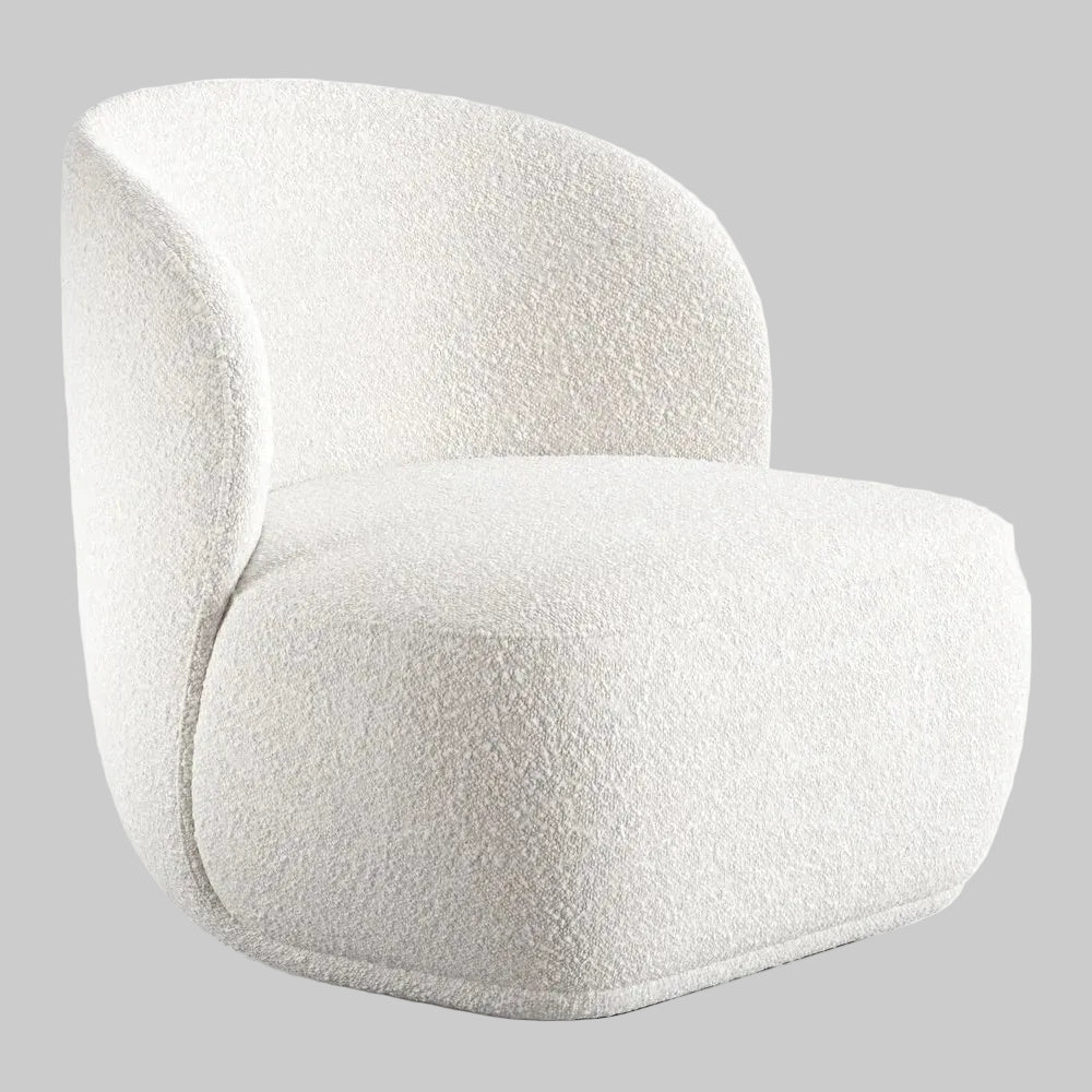 Studio shot of a white boucle barrel chair featuring a soft gray background that highlights its curved armless design and textured material.